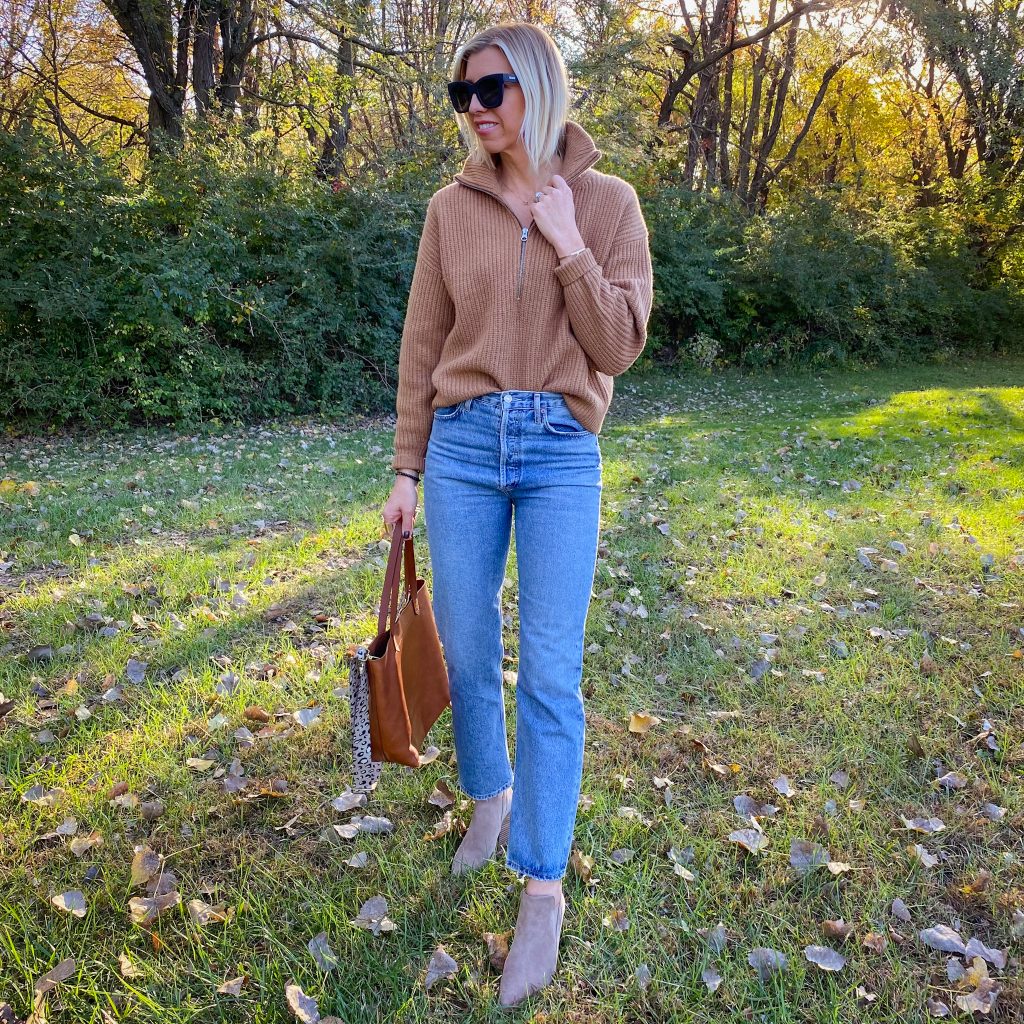 The Haute Homemaker is wearing the Everlane Felted Merino wool half-zip sweater, Agolde 90's pinch waist jeans, Vince Camuto boots, Madewell Medium Transport tote bag