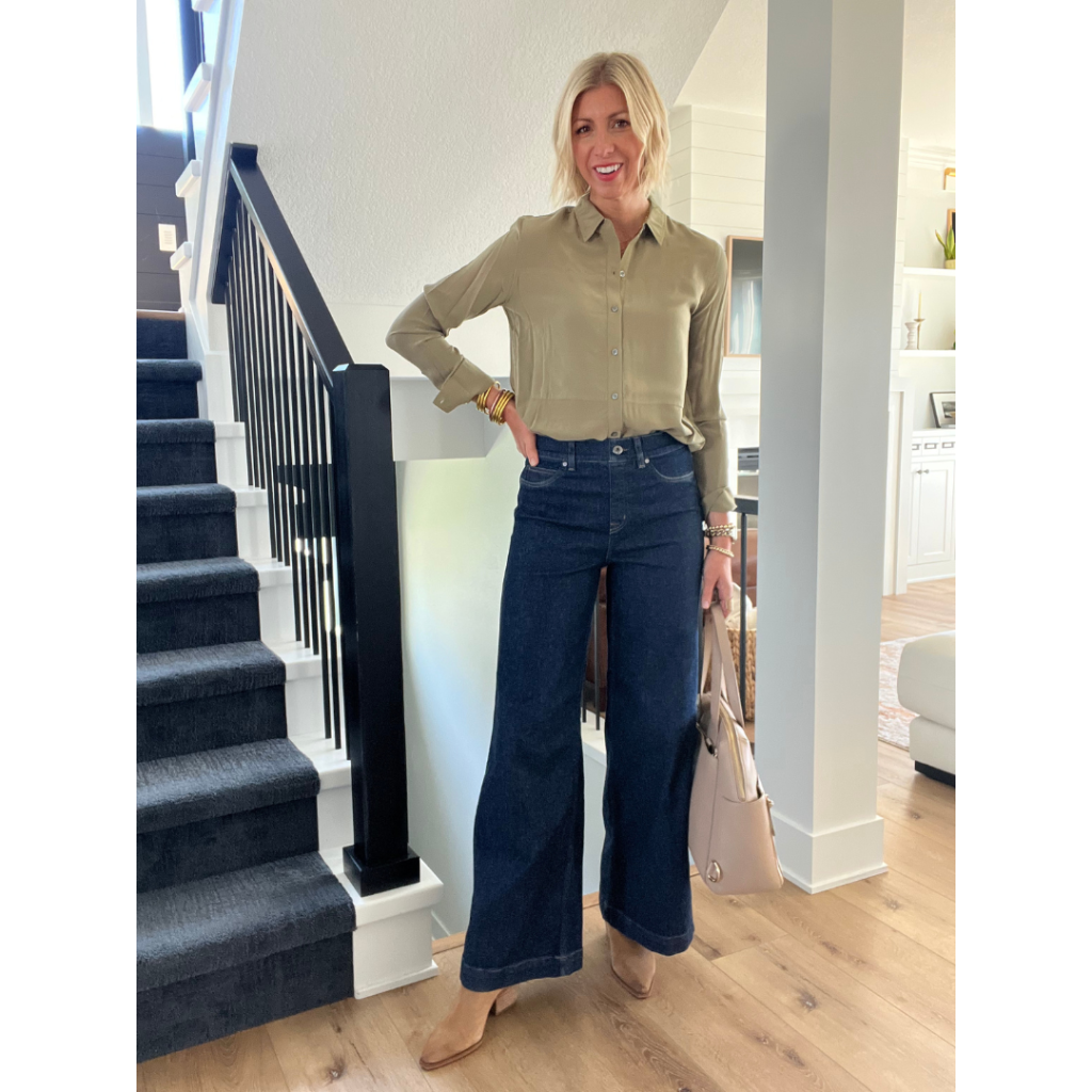 wide leg denim outfit with blouse, boots and handbag