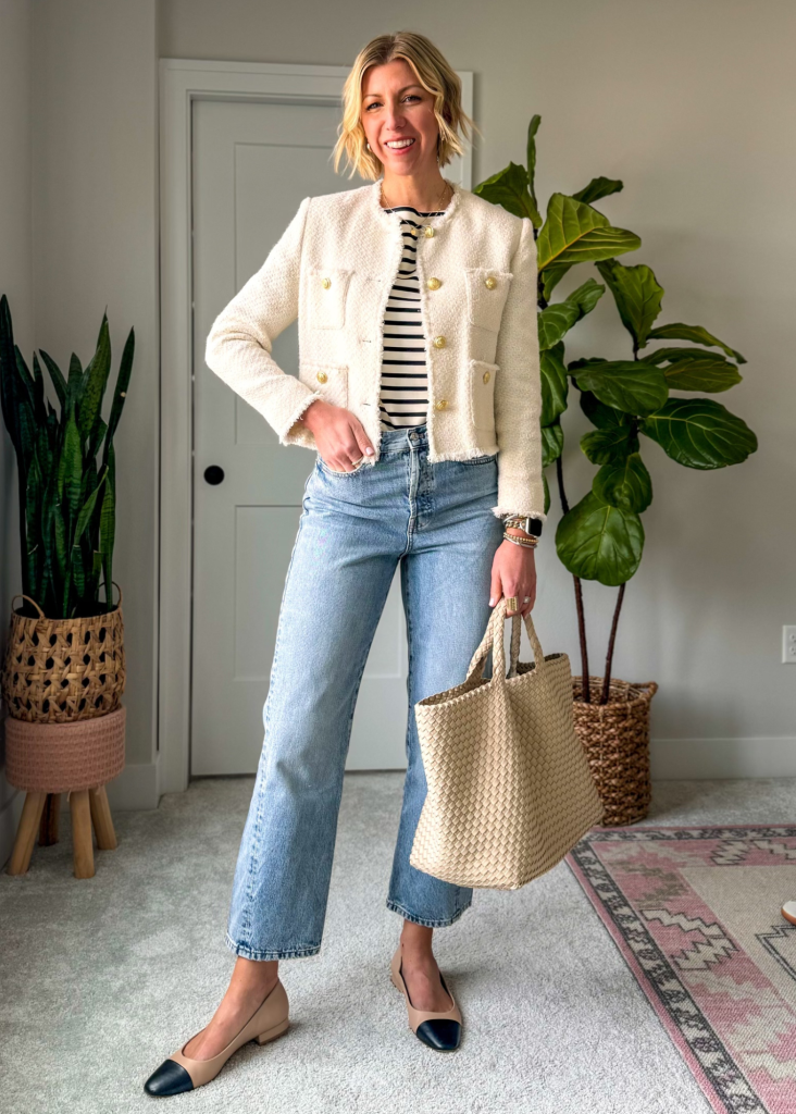 Spring capsule wardrobe outfit with straight leg jeans, stripe tee, lady jacket, ballet flats + woven tote